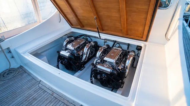 Twin V8 inboards under an open hatch